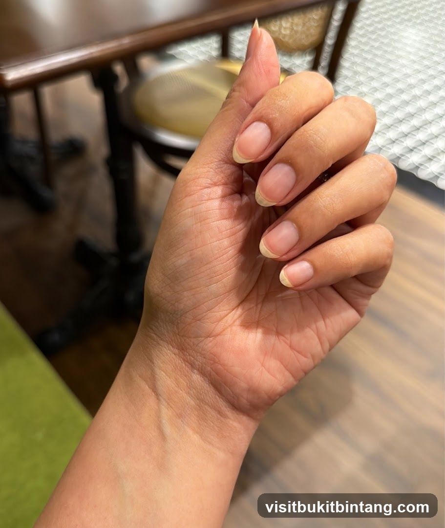 Hand with unpolished nails