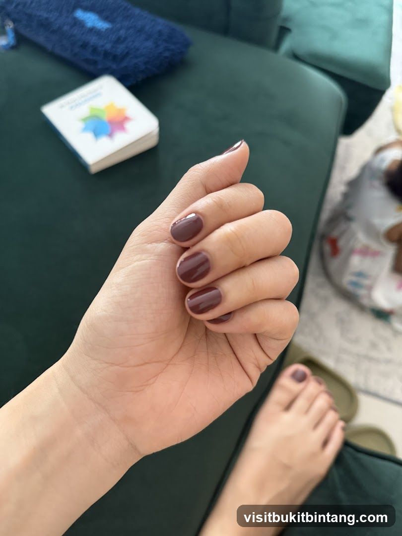 Woman's Hands and Feet with Burgundy Nail Polish