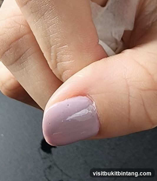 Close-up of a manicured fingernail
