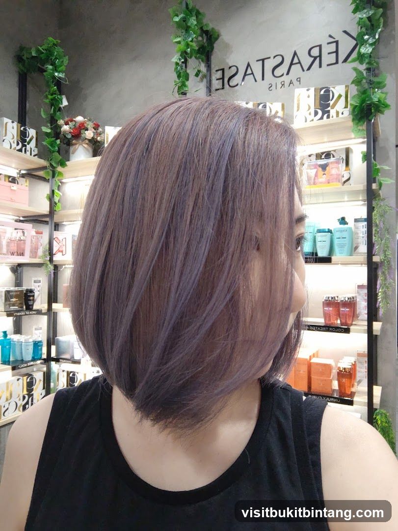 Woman with purple-tinted bob haircut