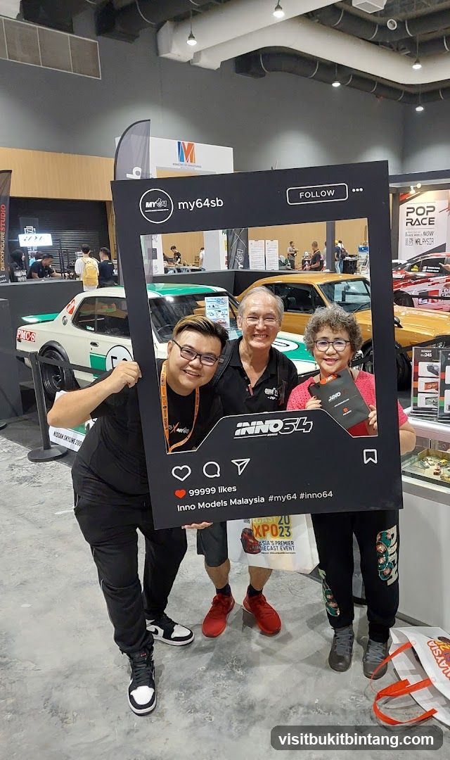 People posing with a large Instagram frame
