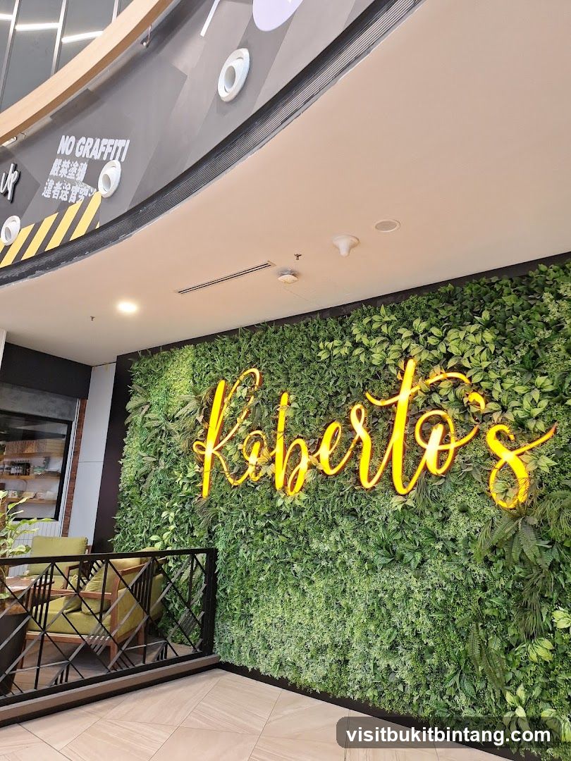 Roberto's Neon Sign on Green Wall
