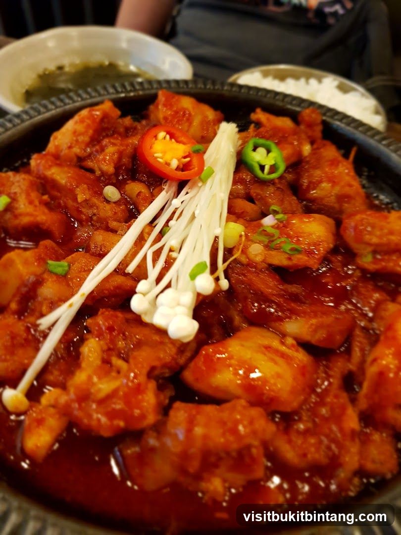 Spicy Braised Chicken with Enoki Mushrooms