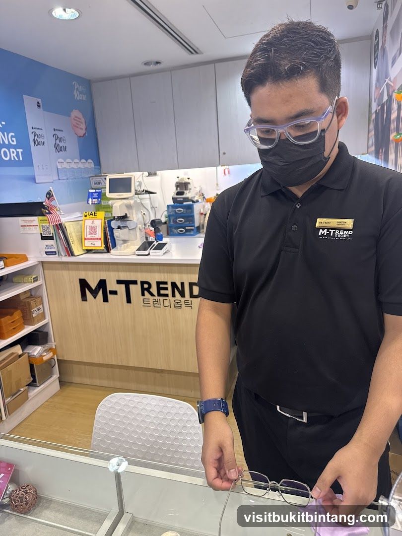 Optician assisting customer