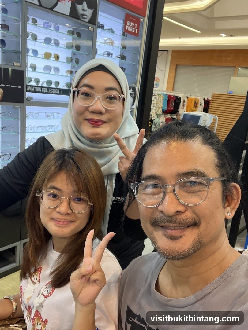 Three people posing for a photo in an optical shop