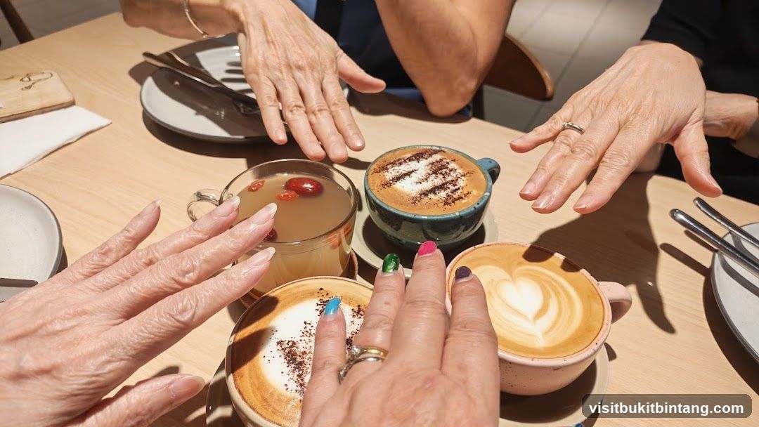 Hands reaching for coffee and tea