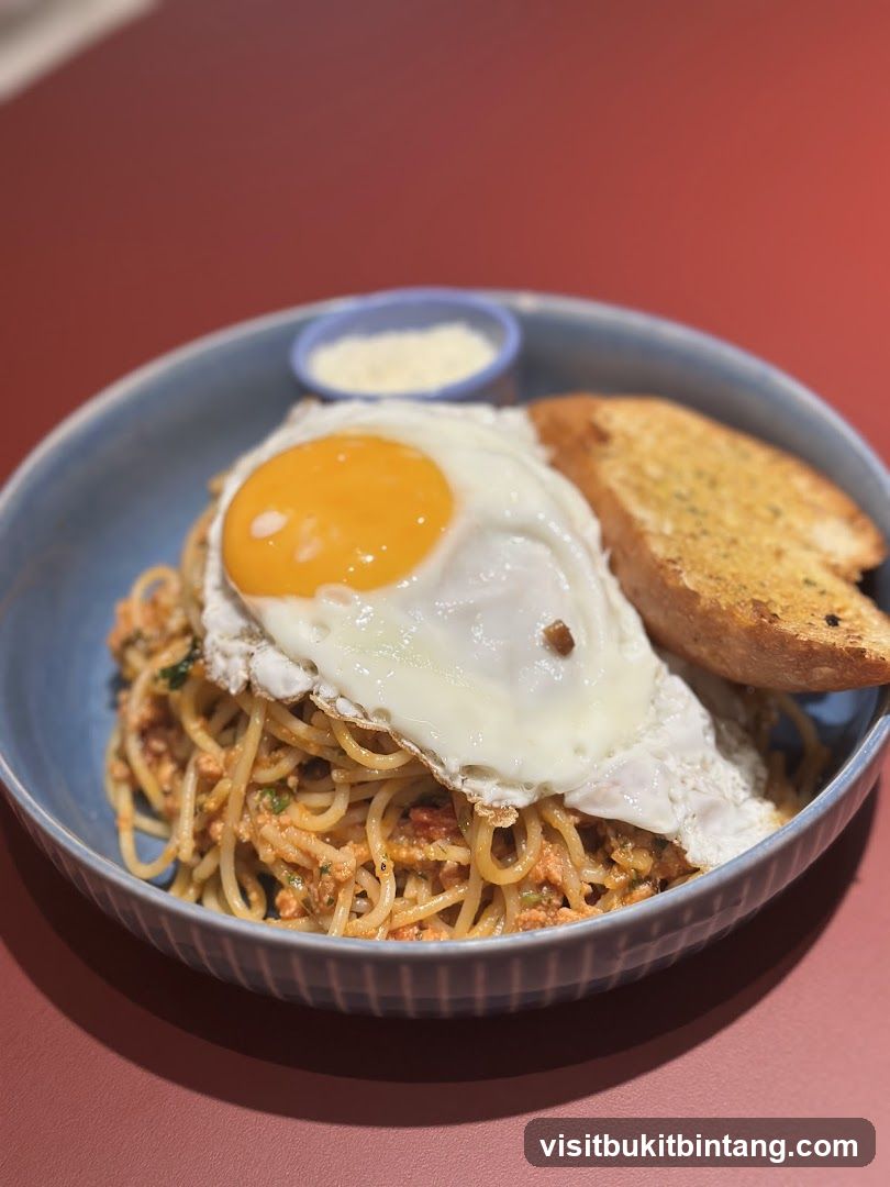 Spaghetti with Fried Egg and Garlic Bread