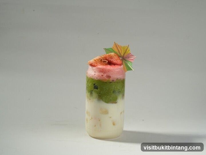 Layered Drink with Fruit and Umbrella