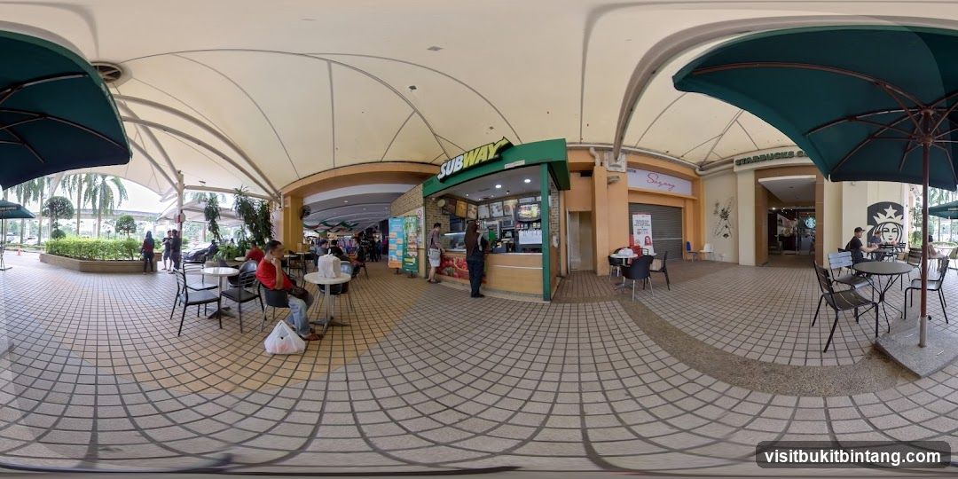 Outdoor dining area with Subway and Starbucks