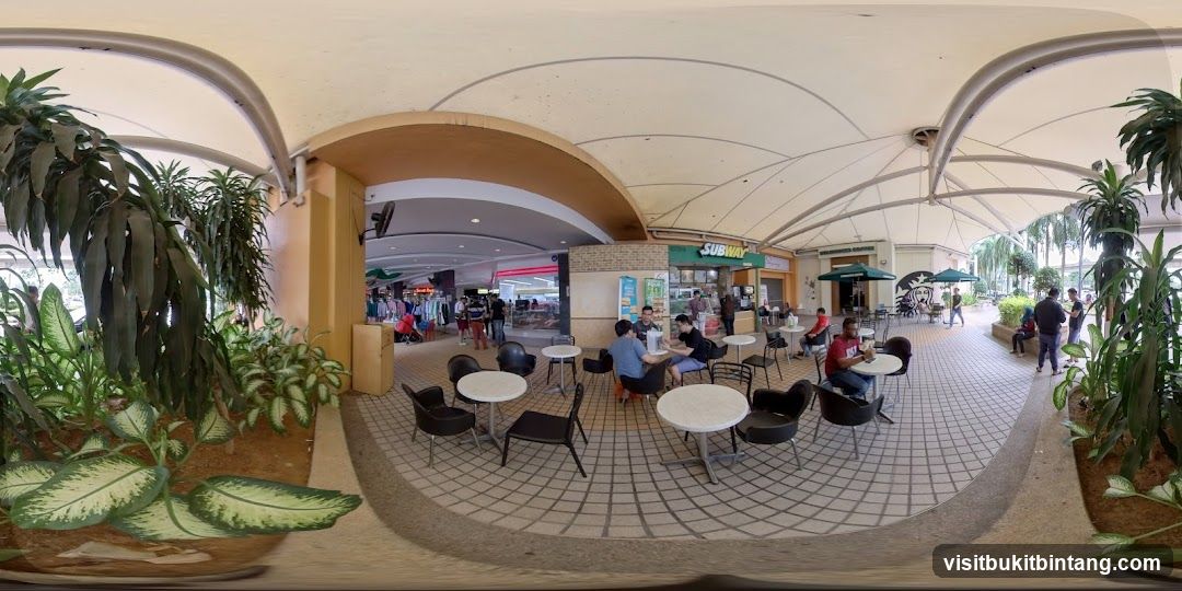 Outdoor seating area with shops