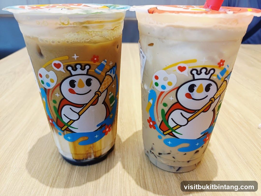 Two iced drinks with cartoon snowman logo