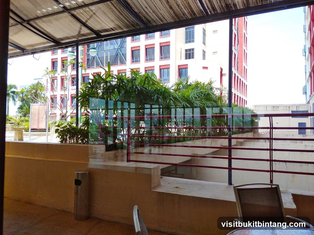Outdoor seating area with buildings in the background