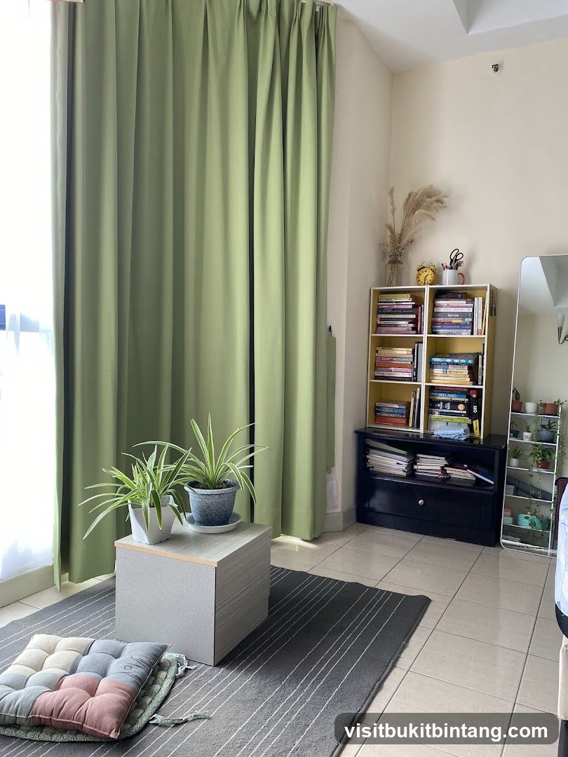 Living room corner with plants and books