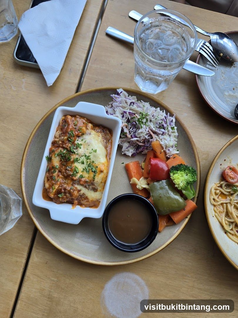 Lasagna with side salad and vegetables