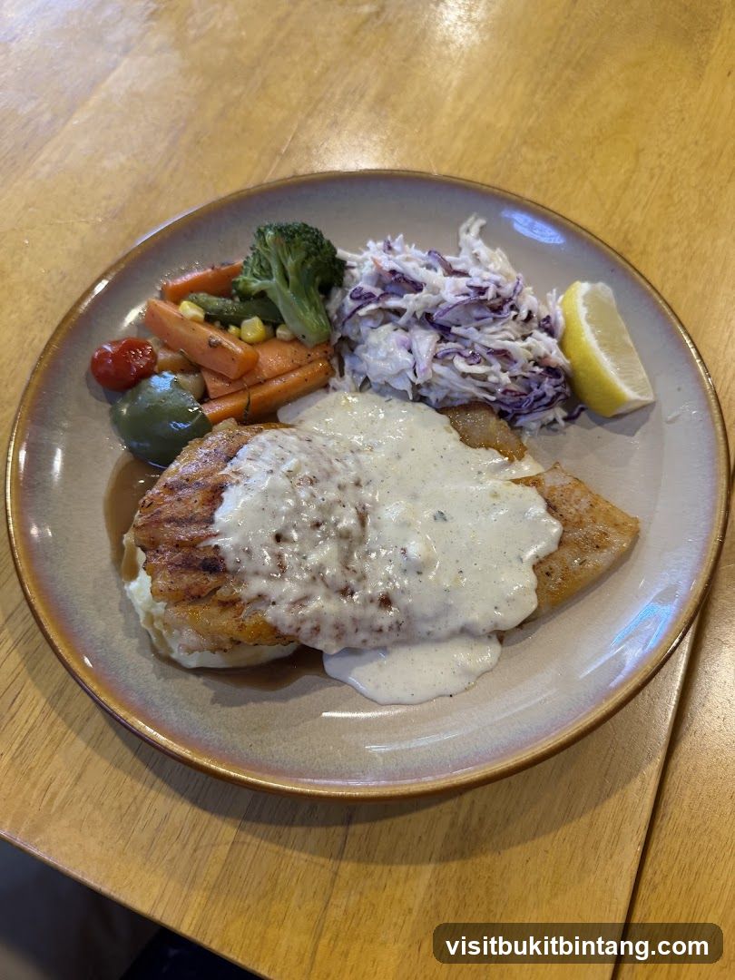 Fish dish with vegetables and coleslaw