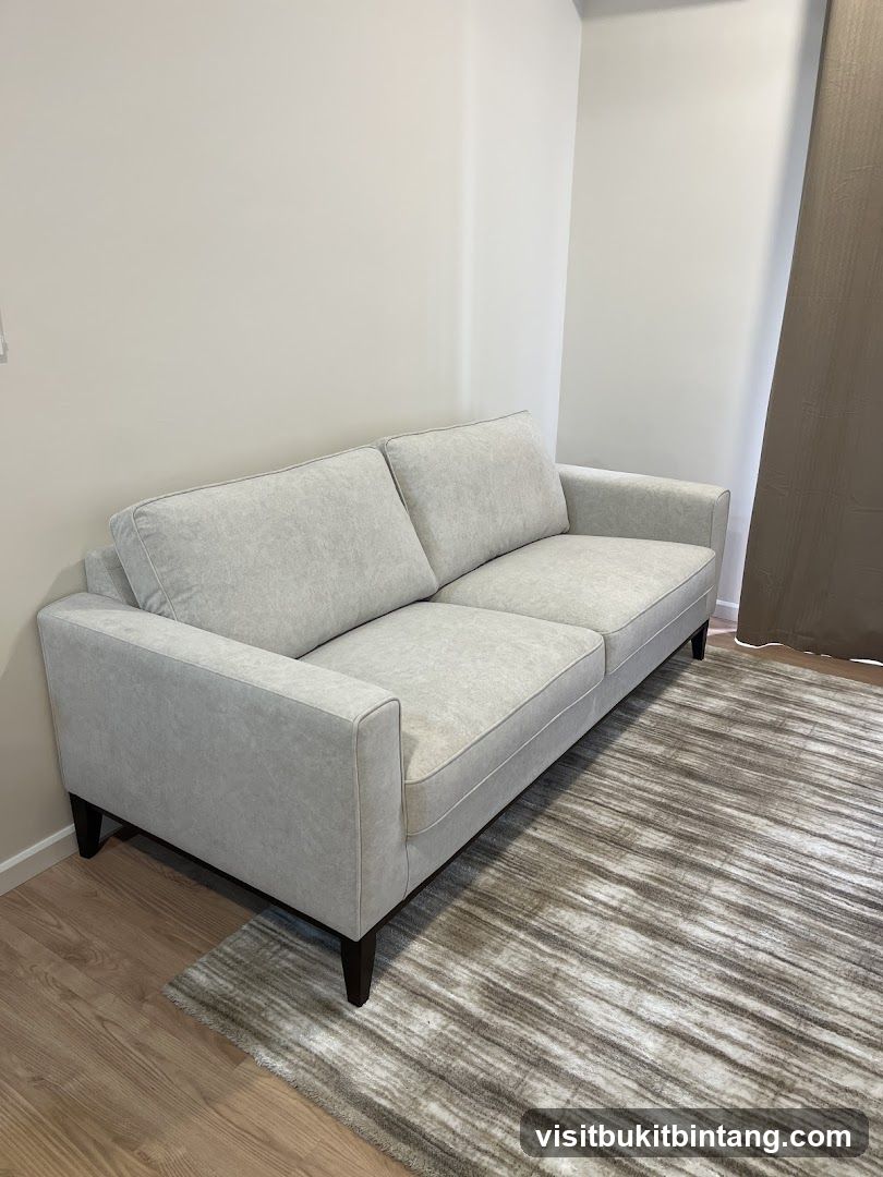 Light Gray Sofa on Striped Rug