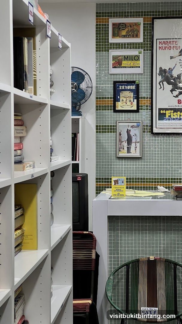 Interior of a shop with bookshelves and vintage advertisements