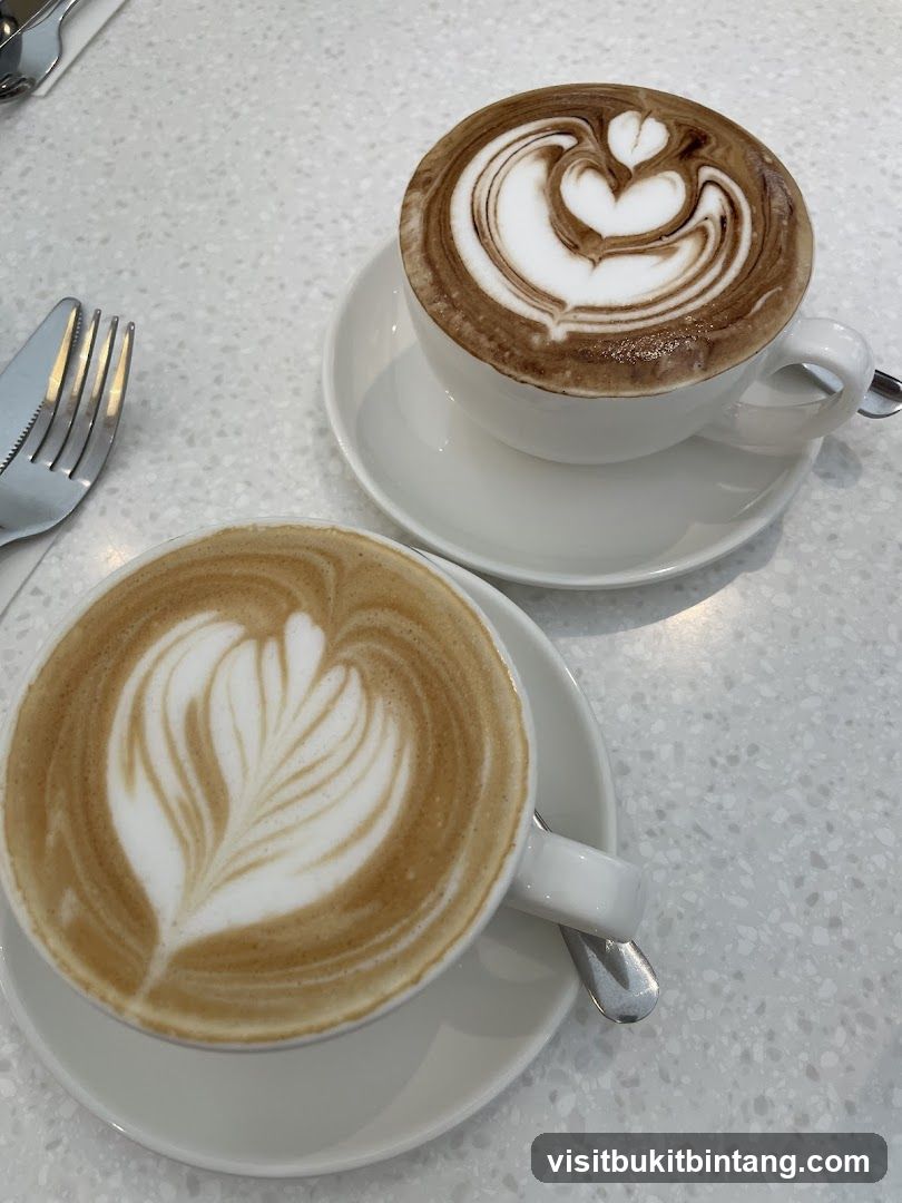 Two coffees with latte art