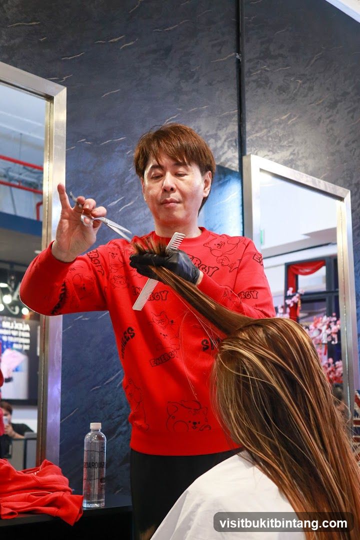 Hairdresser cutting hair