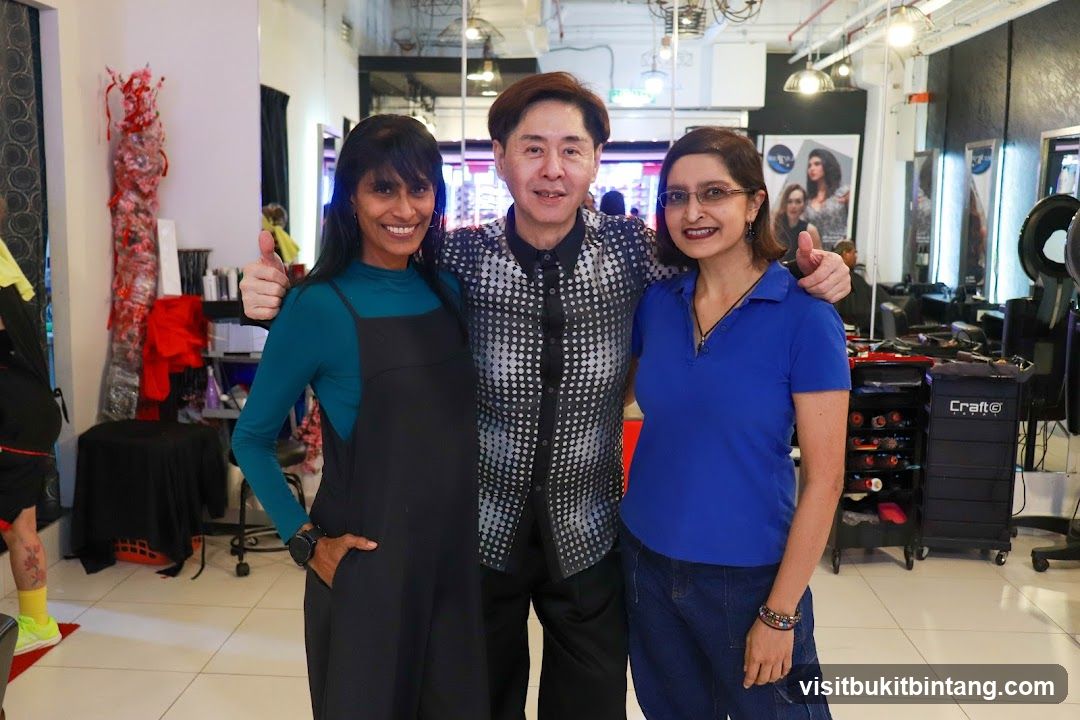 Three people posing in a salon