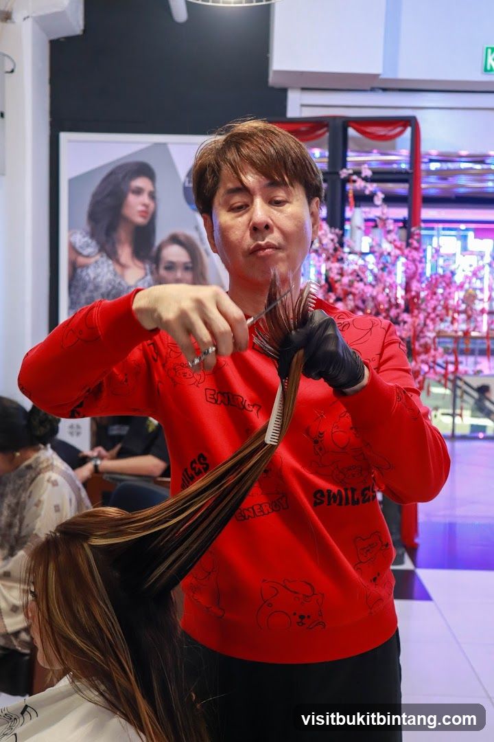 Hairdresser cutting client's hair