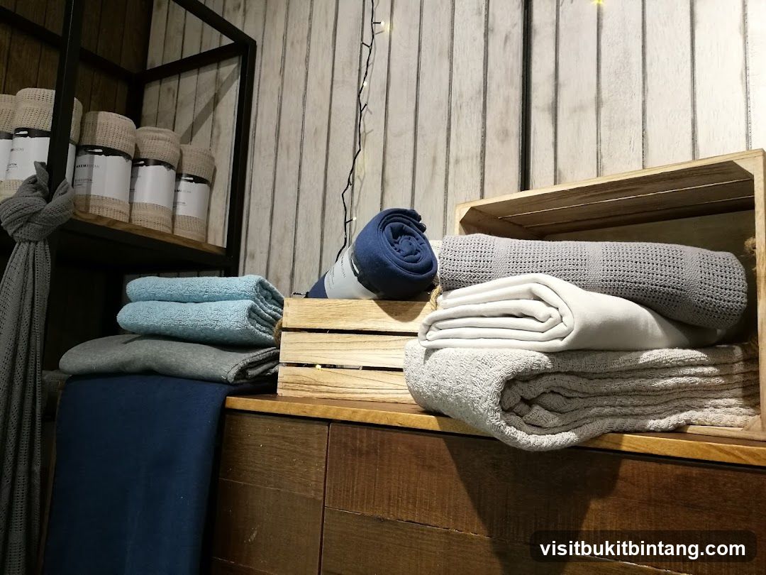 Folded blankets and throws on display