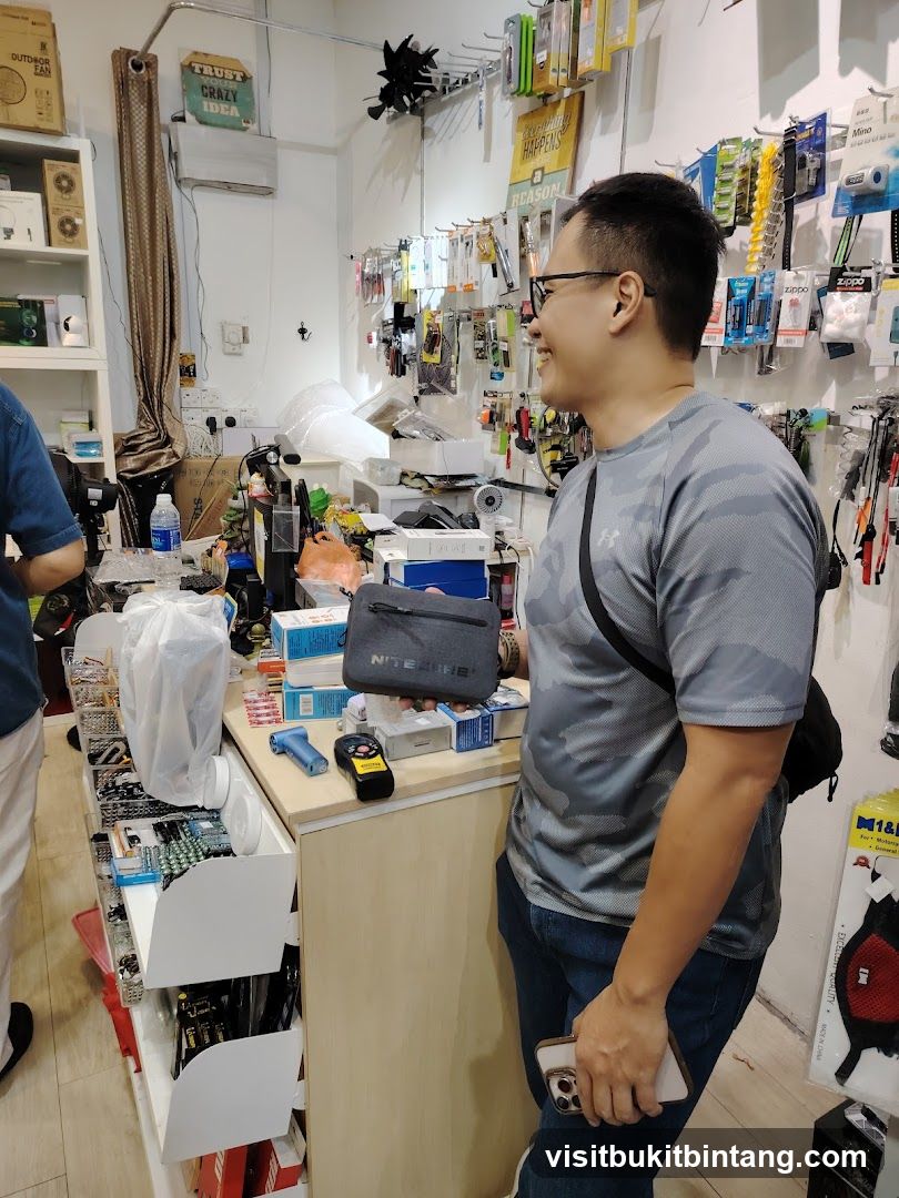 Man holding a pouch in a store