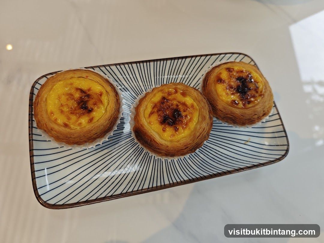 Three Egg Tarts on a Plate