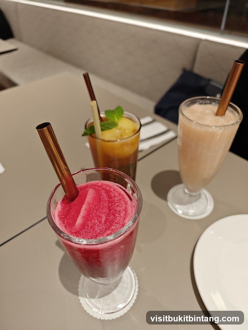 Three colorful drinks on a table