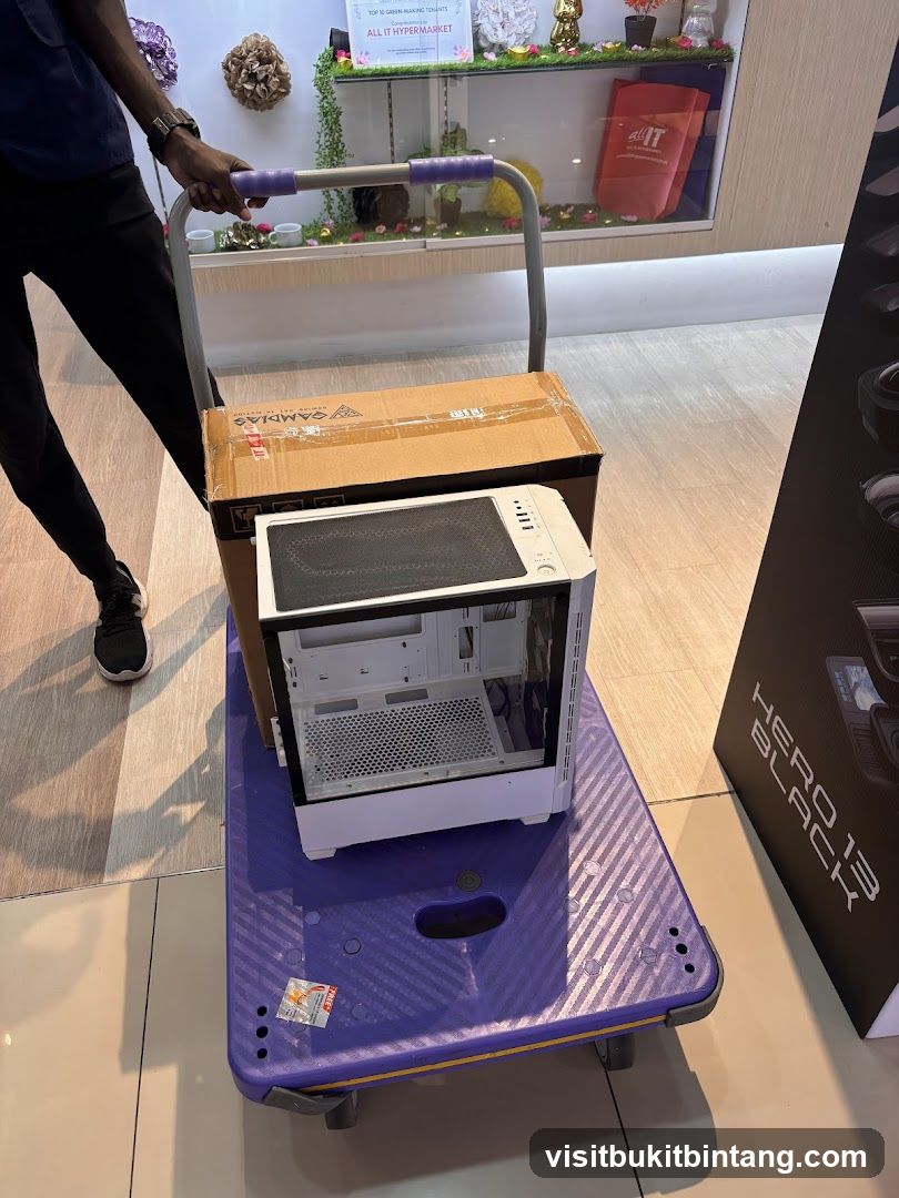 Person pushing a cart with computer parts