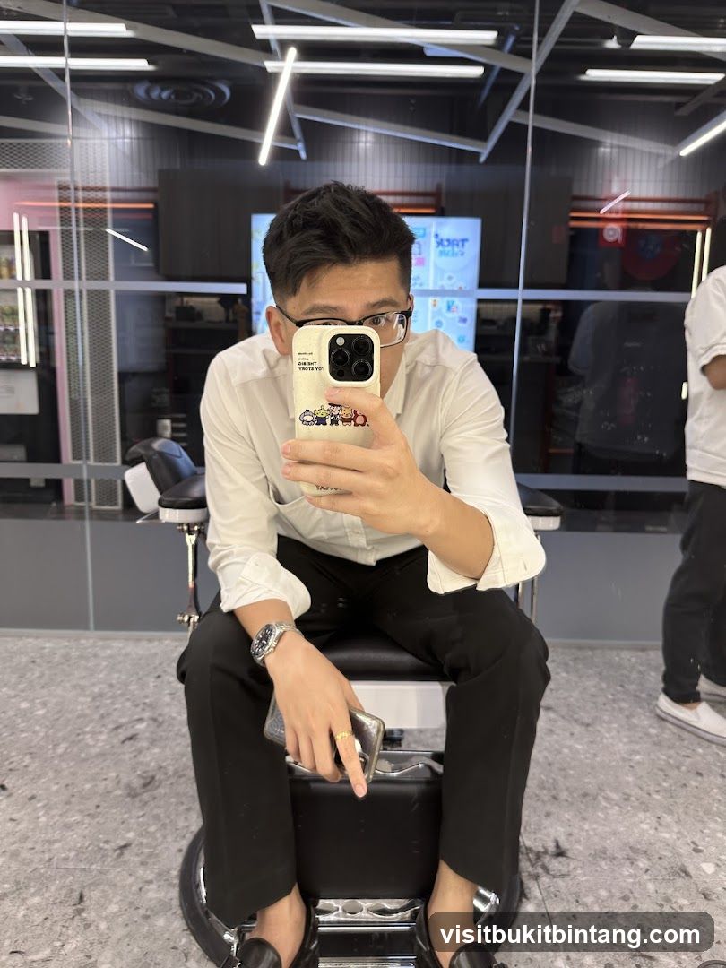 Man taking a selfie in a barber shop