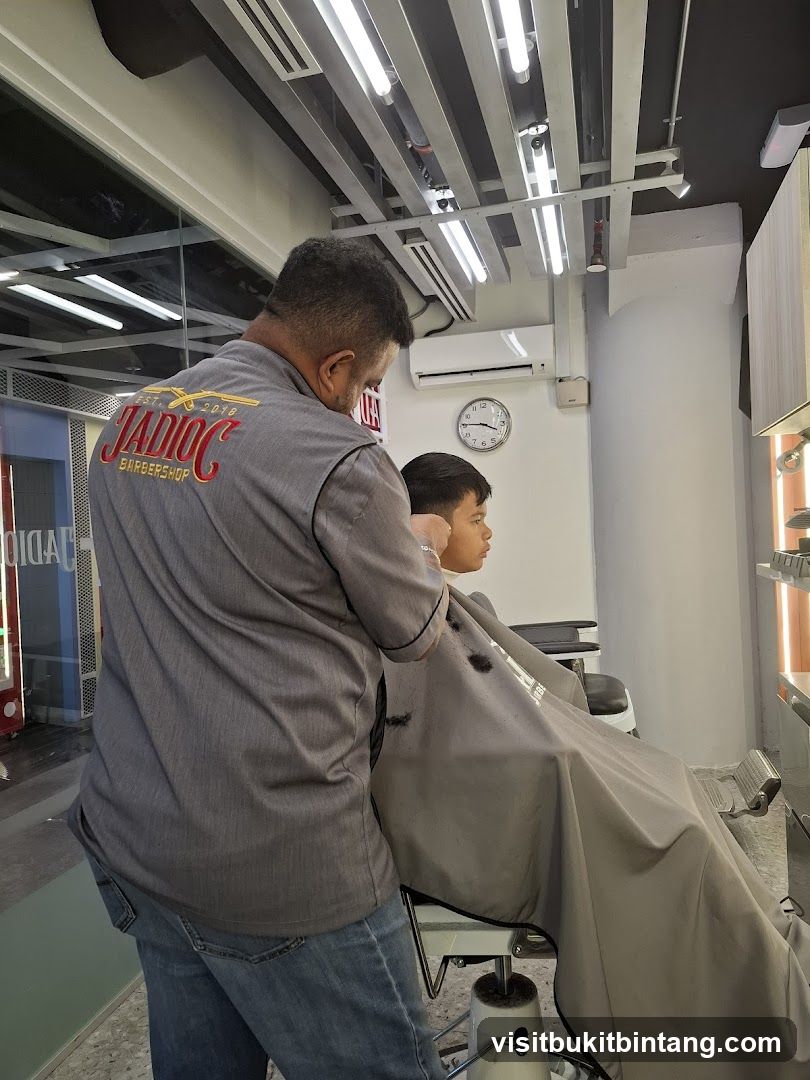 Barber cutting a boy's hair