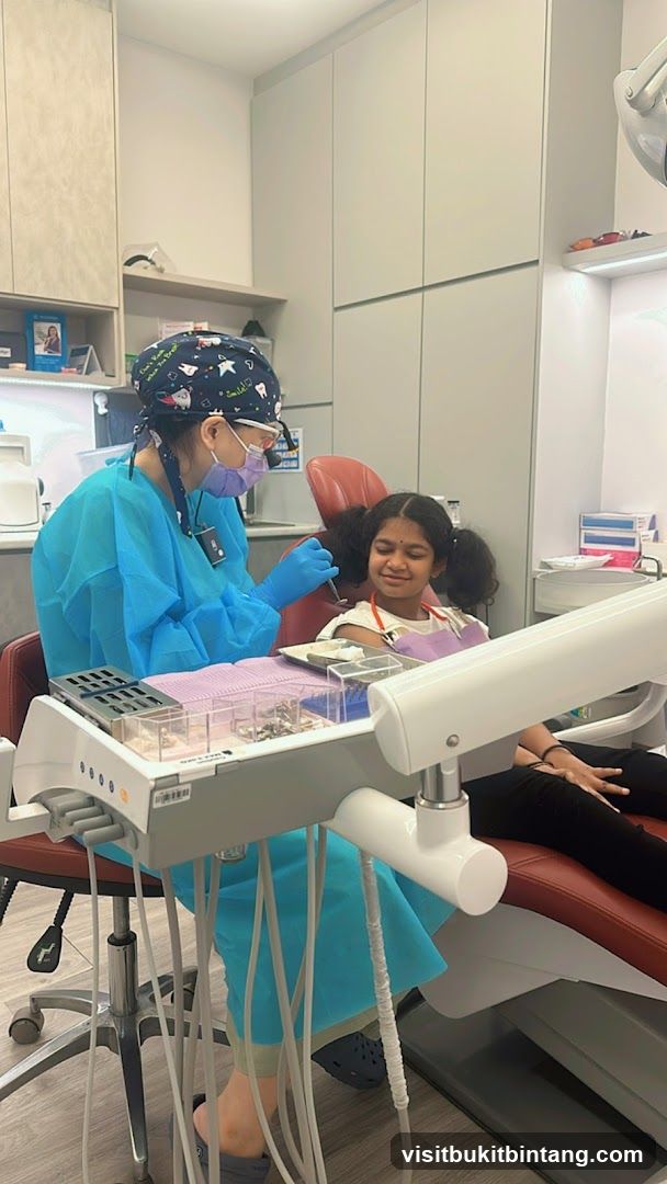 Dentist examining a young patient