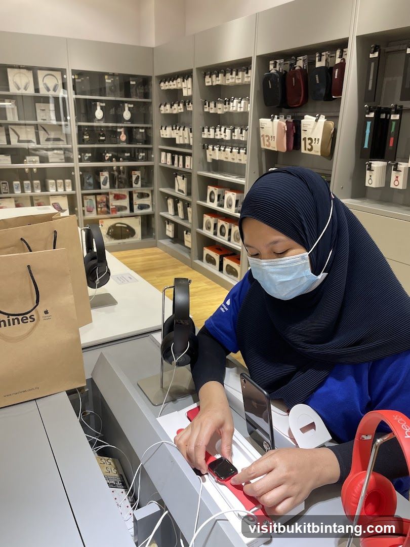 Store employee arranging a smartwatch