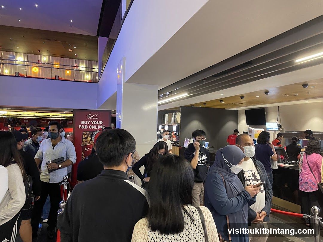 People queuing at a cinema concession stand