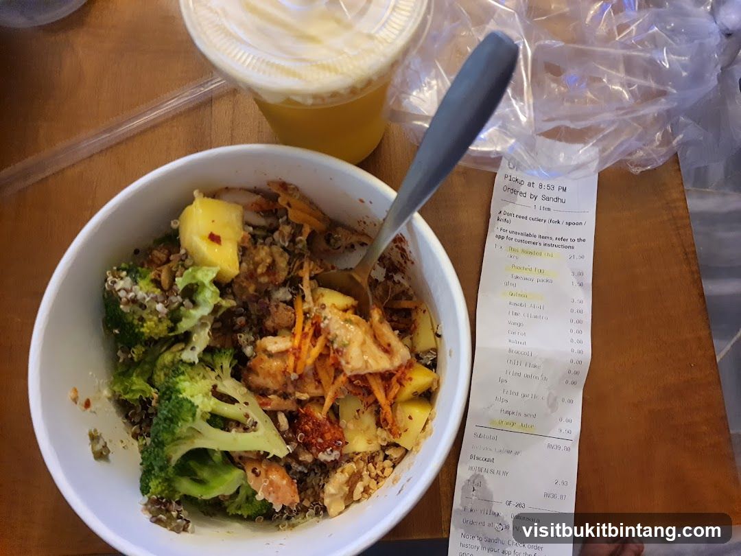 Bowl of food with receipt and drink