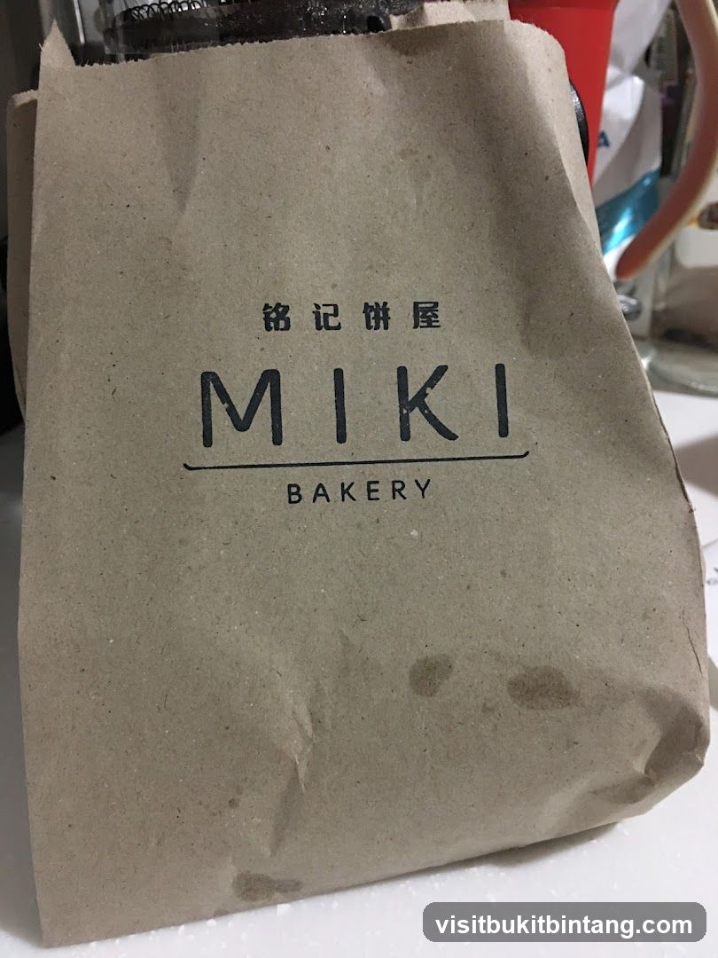 Brown paper bag with MIKI BAKERY logo