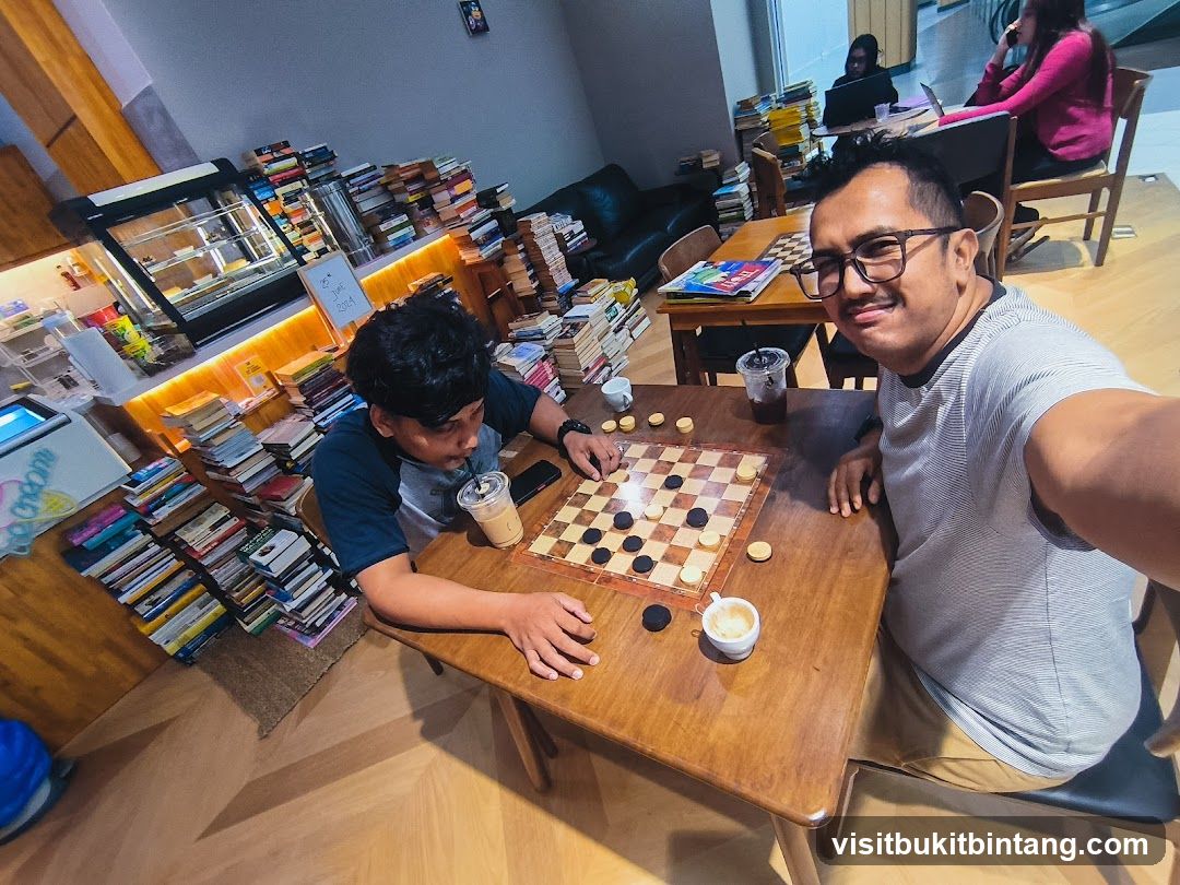 People playing checkers in a cafe