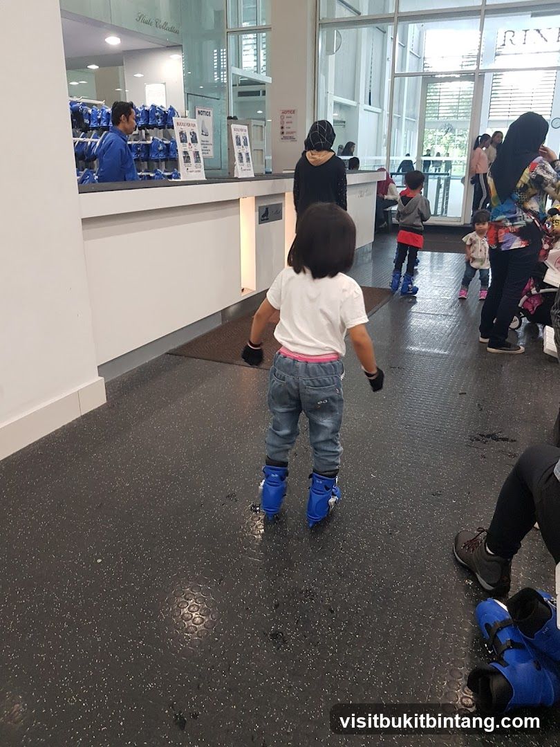 People at an indoor skating rink