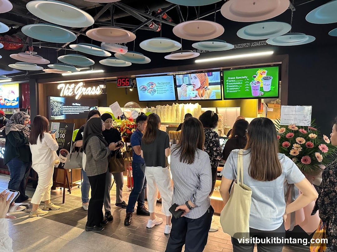 People waiting in line at a food establishment