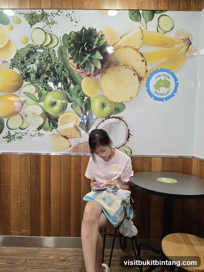 Girl sitting at table with fruit mural