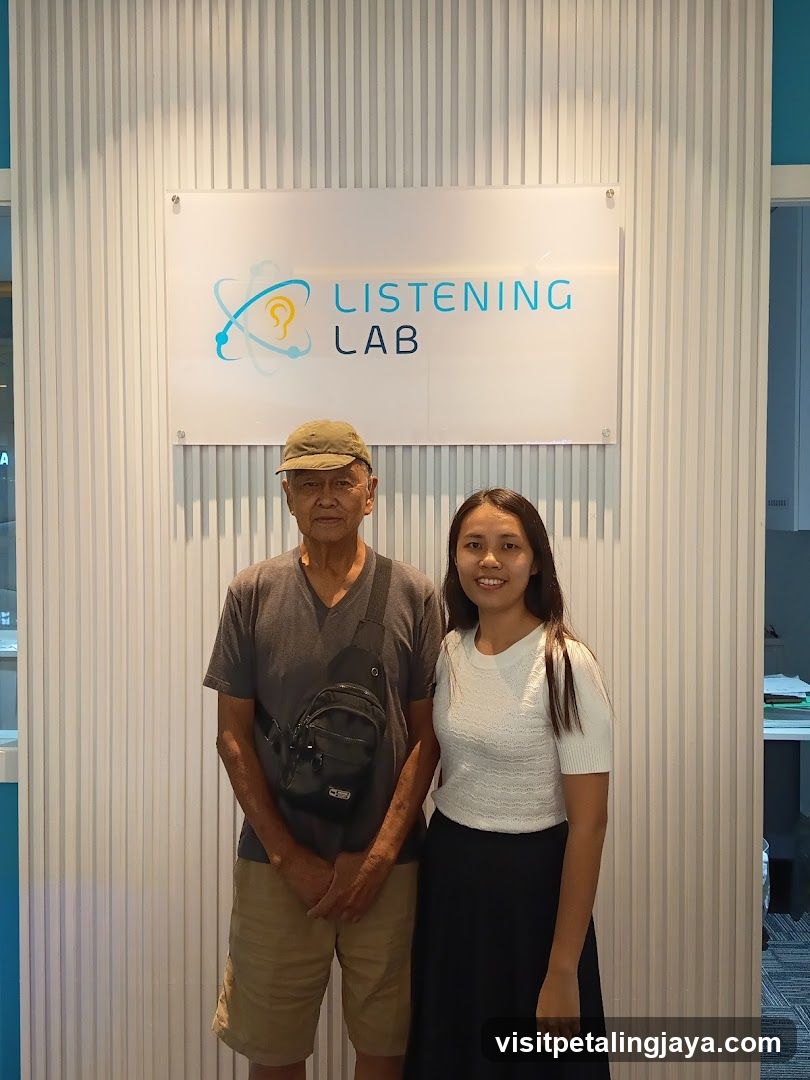 Listening Lab Signage with Two People Standing