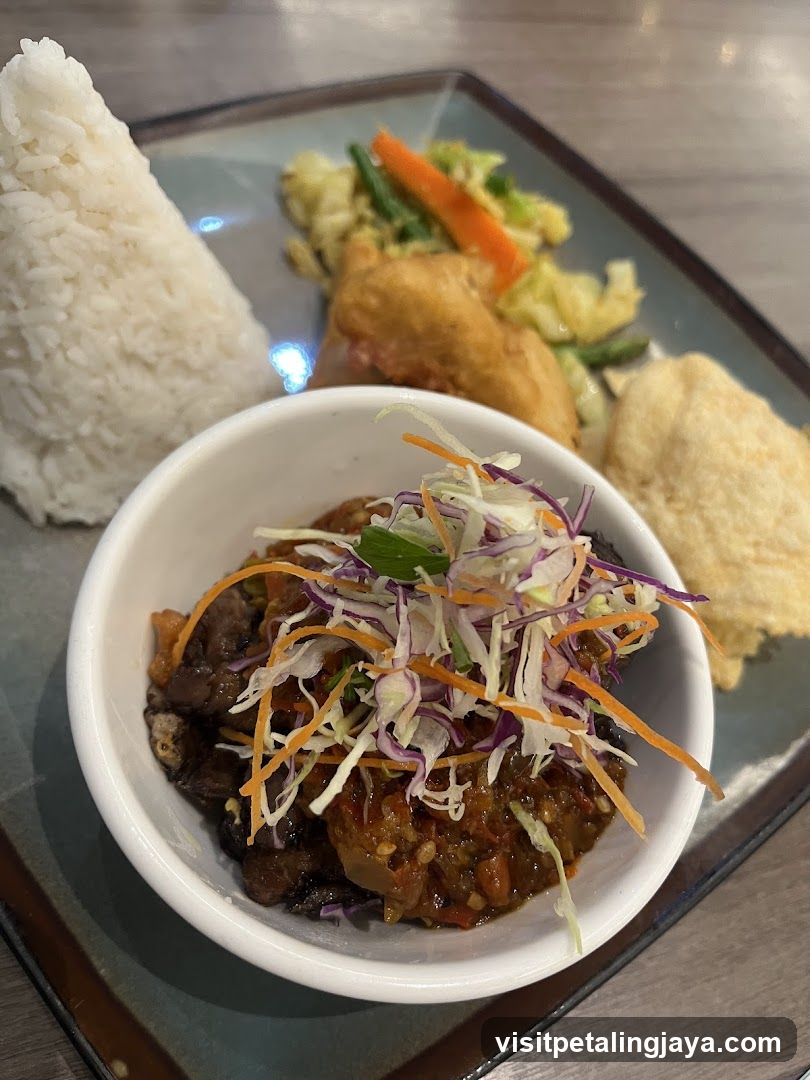Bowl of Spicy Stir-fry with Coleslaw and Side Dishes