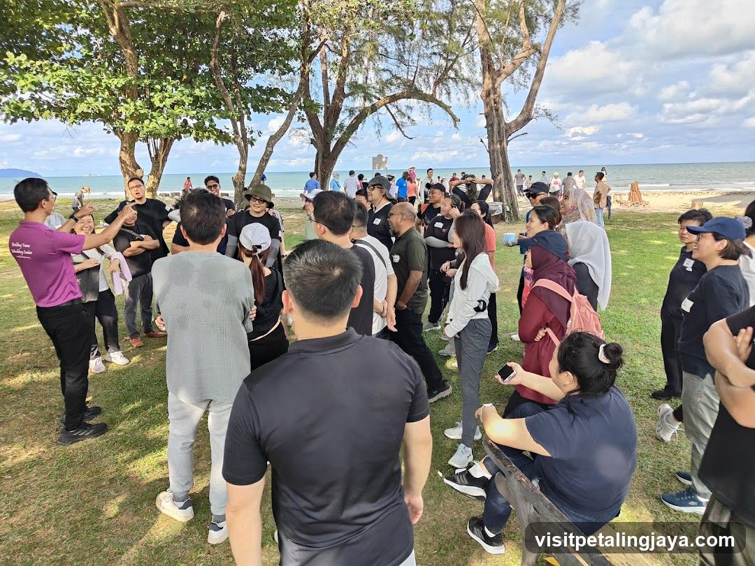 Group gathering outdoors near beach