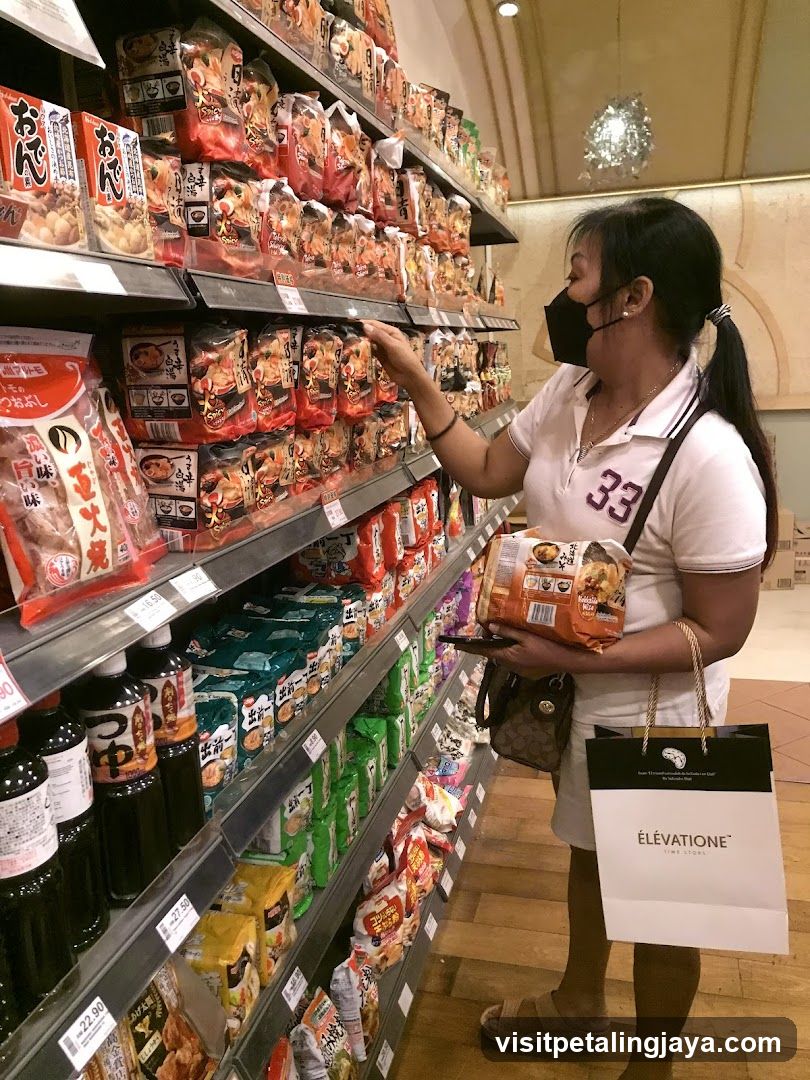 Woman shopping in a grocery store aisle