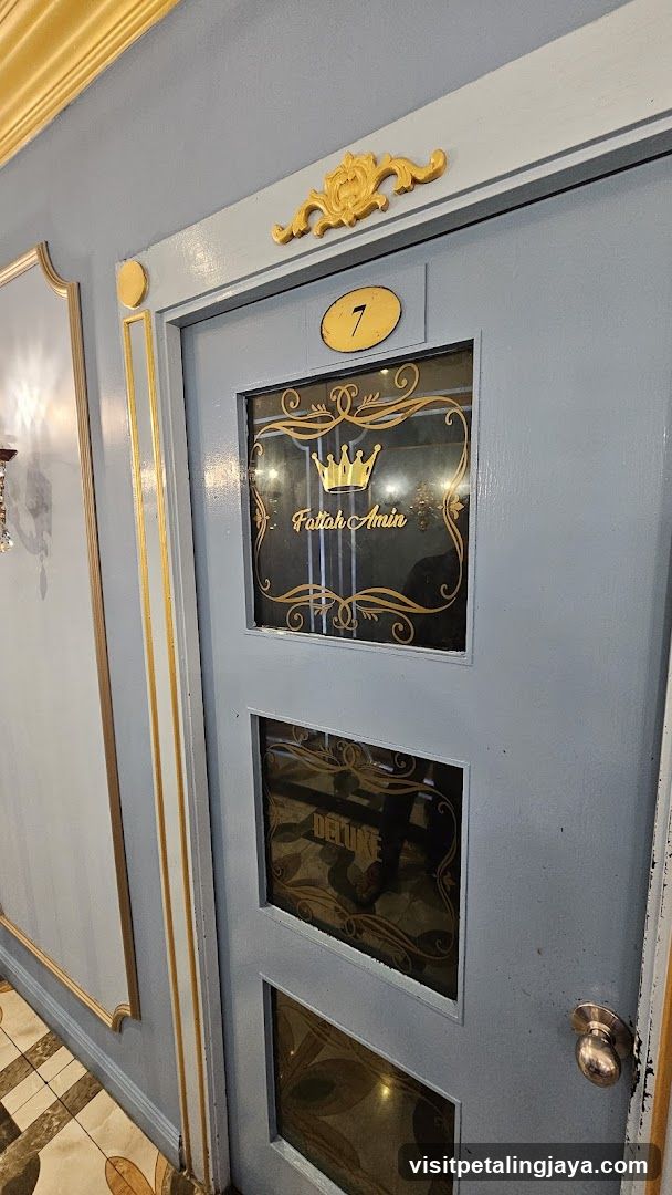 Door with glass panels and gold lettering