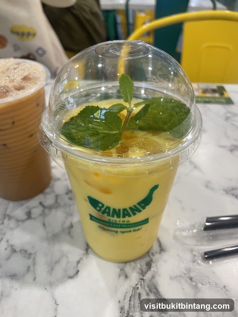 Yellow Drink with Mint Garnish