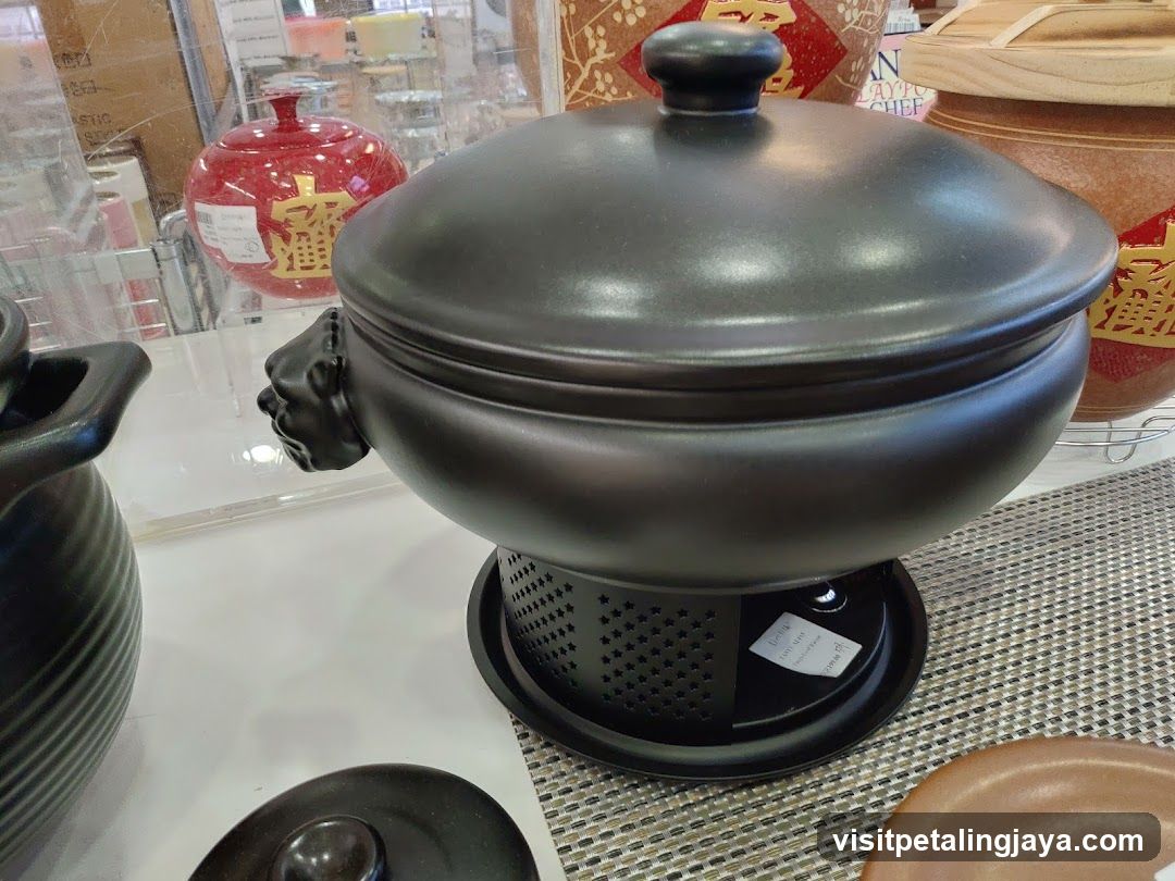 Black ceramic pot with lion handle