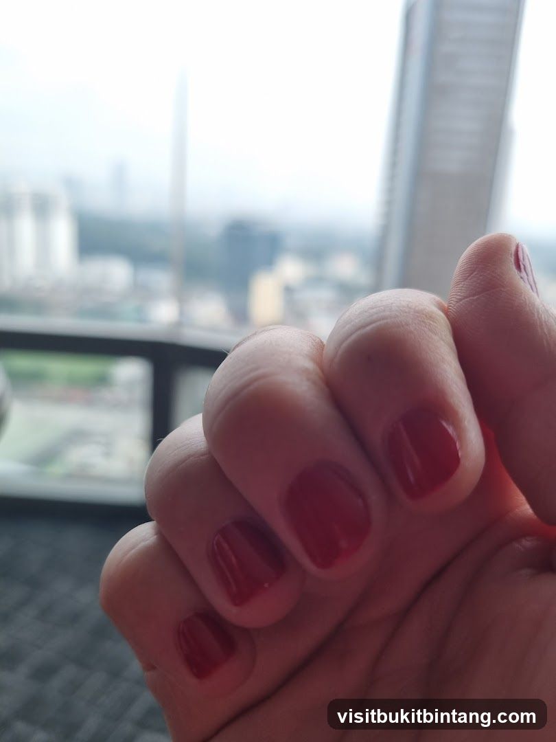 Hand with Red Nail Polish