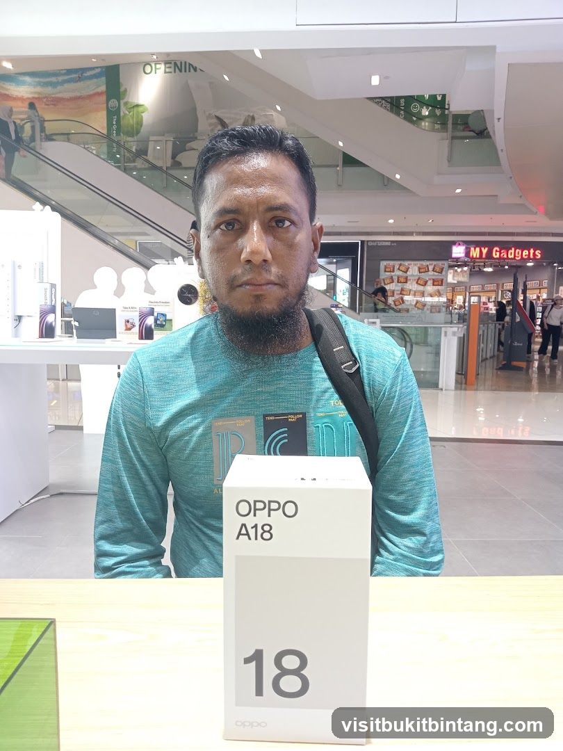Man Posing with OPPO A18 Box